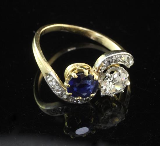 A 1940s/1950s? gold, sapphire and diamond crossover ring, size L.